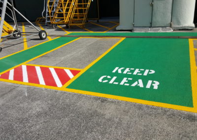 Green non-skid walkway with Keep Clear stencil
