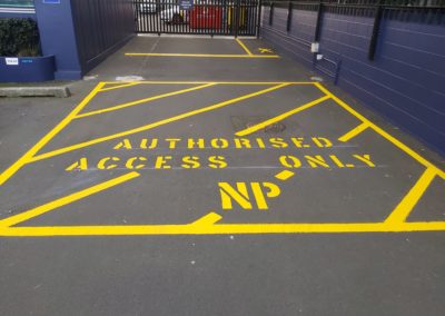 Yellow hatching with Authorised Access stencil