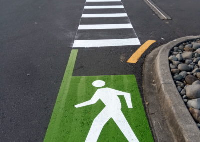 Green walkway and pedestrian crossing